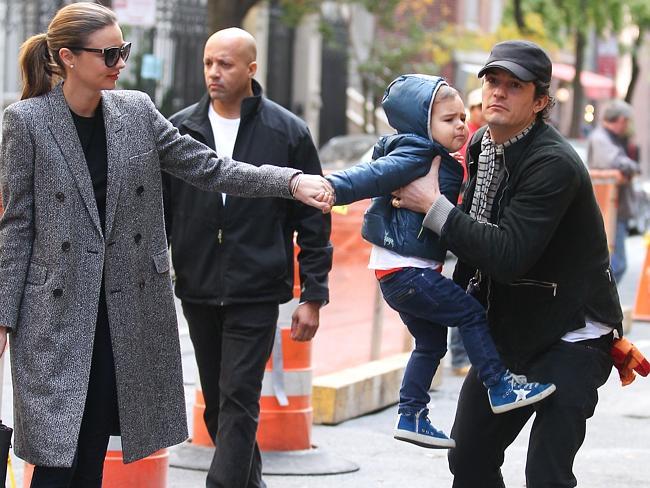 Orlando Bloom and Miranda Kerr take their son Flynn go for a walk in Manhattan just days after announcing their separation in October 2013. 