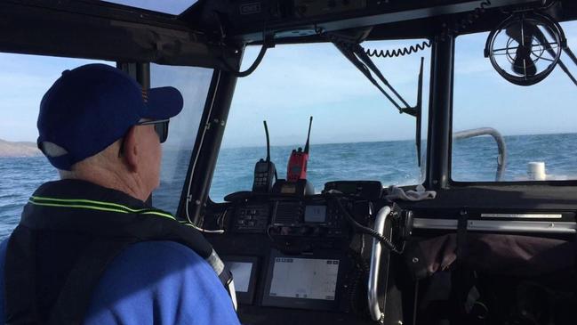 Marine Rescue NSW volunteers search at Nambucca Heads for two paddleboarders reported missing.