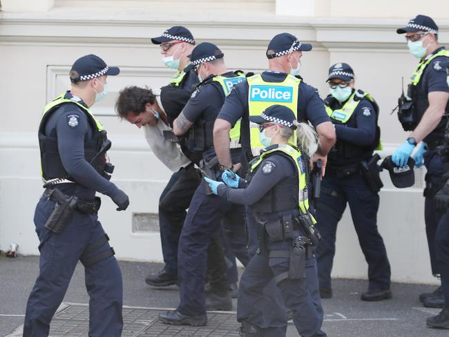 Police try to stop protesters during day four of the disruptive protests on Thursday. Picture: David Crosling