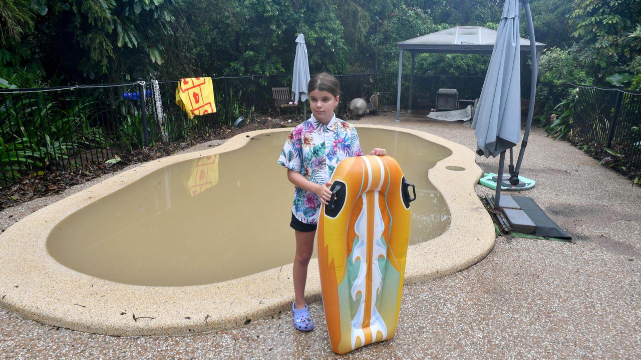 Tuesday February 4. Heavy rain causes flooding in North Queensland. Nyah Waugh, 9, at the pool of her Forrestry Road home inundated by a fast rising Bluewater Creek. Picture: Evan Morgan