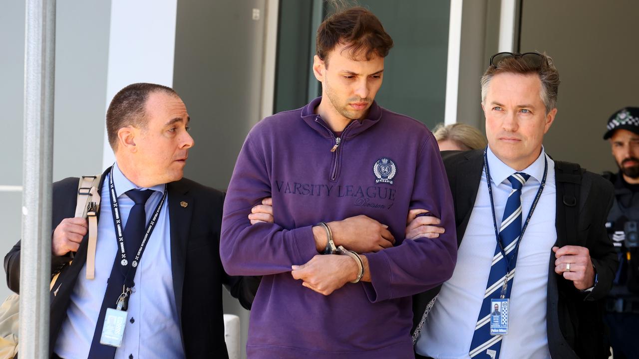 Zacharia Bruckner flanked by police at Adelaide Airport after being extradited from Queensland. Picture: NCA NewsWire / Kelly Barnes