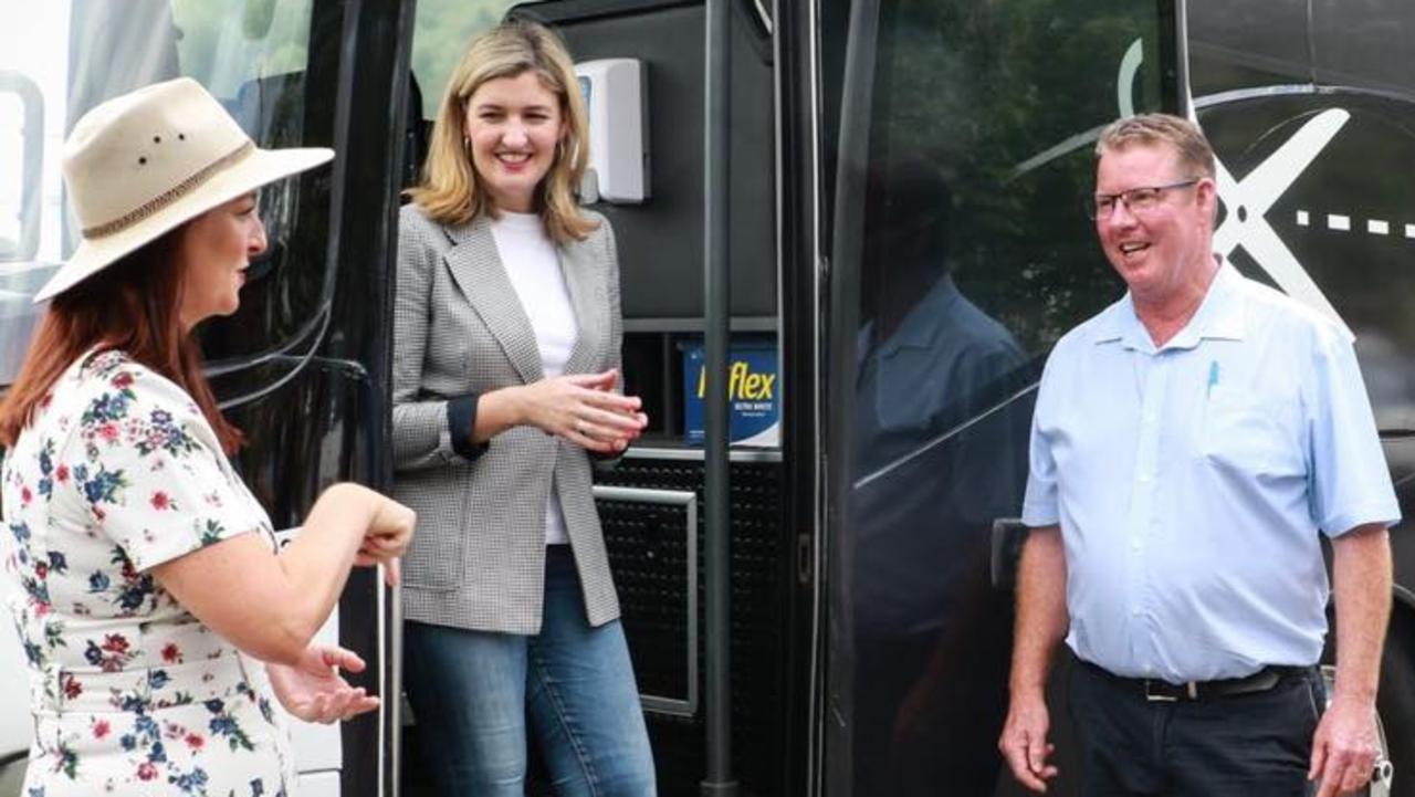 Keppel MP Brittany Lauga (left), Small Business Minister Shannon Fentiman, and Rockhampton MP Barry O'Rourke with the Cuts Bus.