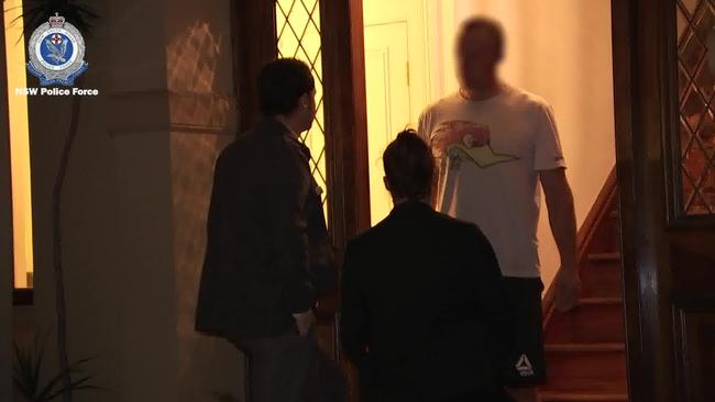 Police arresting Day at his home on Wednesday. Picture: NSW Police