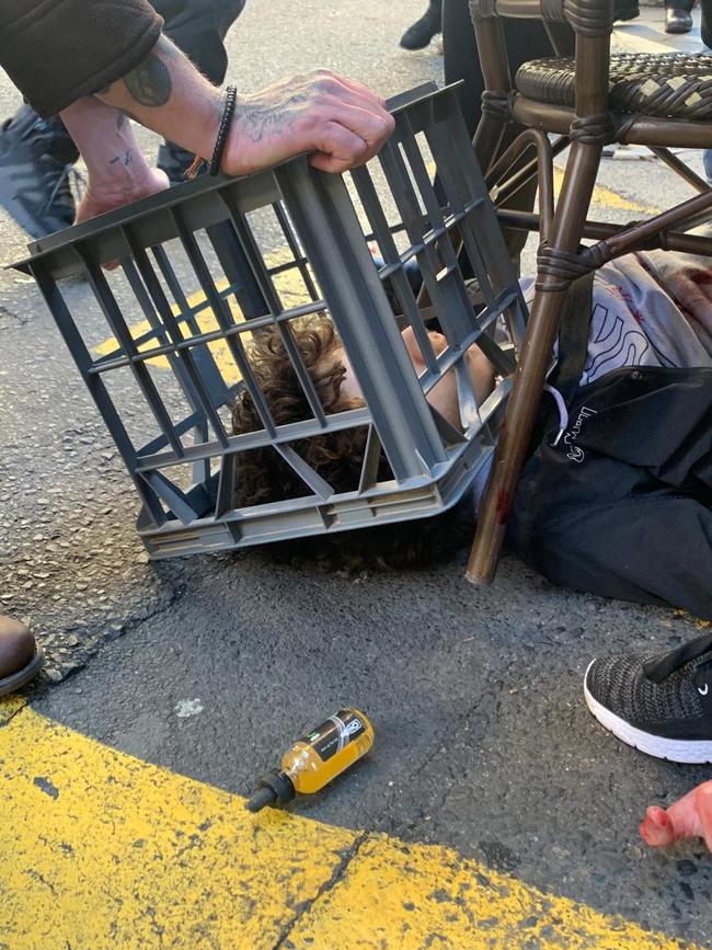 Ney was pinned down with a milk crate and chairs by members of the public.