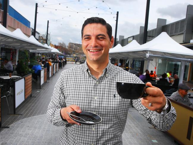 Ned Mannoun at a cafe in Macquarie Mall, which he was instrumental in getting refurbished. Picture: Supplied