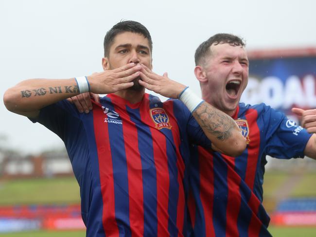 NEWCASTLE, AUSTRALIA - FEBRUARY 09: Dimitri Petratos of the Newcastle Jets celebrates his goal with team mate Bobby Burns during the round 18 A-League match between the Newcastle Jets and the Central Coast Mariners at McDonald Jones Stadium on February 09, 2020 in Newcastle, Australia. (Photo by Ashley Feder/Getty Images)
