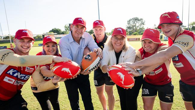 Dolphins players Oryn Keeley, Thomas Flegler, Harrison Graham and James Walsh with ministers Robyn Cahill, Gerard Maley and Marie-Clare Boothby.