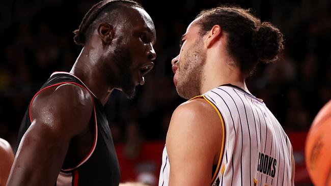 Let’s play some ball: Mangok Mathiang and Xavier Cooks get heated in an exchange of words. Picture: Getty Images