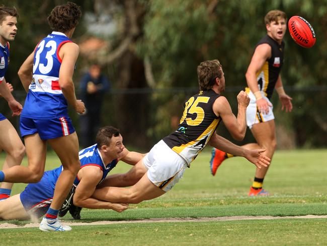 Alex Urban is caught in a tackle. Picture: Stuart Milligan