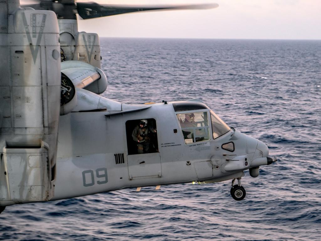 A U.S. Marine Corps MV-22B Osprey with Marine Medium Tiltrotor Squadron 265 (Reinforced), 31st Marine Expeditionary Unit (MEU), prepares for landing aboard the amphibious assault ship USS America (LHA 6), during Talisman Sabre on July 14, 2021. The MV-22B provides combat commanders with extended range and flexibility for a wide range of missions. Australian and U.S. forces combine biannually for Talisman Sabre, a month-long multi-domain exercise that strengthens allied and partner capabilities to respond to the full range of Indo-Pacific security concerns. The 31st MEU is operating aboard ships of America Expeditionary Strike Group in the 7th fleet area of operations to enhance interoperability with allies and partners and serve as a ready response force to defend peace and stability in the Indo-Pacific region. (U.S. Marine Corps photo by Staff Sgt. John Tetrault)