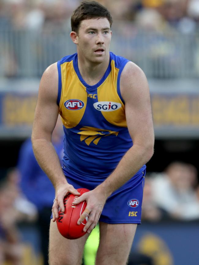 Eagles Jeremy McGovern prepares to kick against the Melbourne Demons at Optus Stadium. Picture: Richard Wainwright/AAP