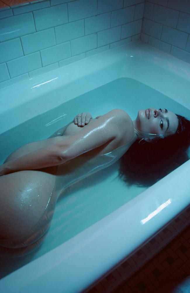 Ratajkowski posed in the bath in one photo.