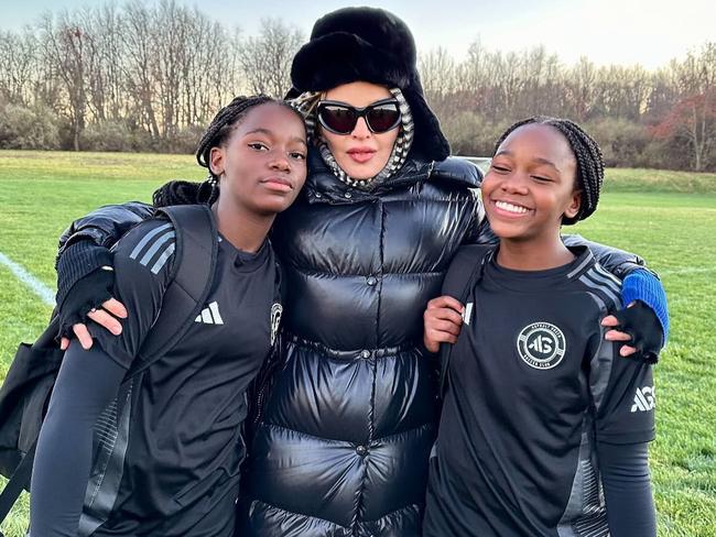 Madonna ‘soccer momming’ with her 12-year-old twin daughters Estere and Stella. Picture: Instagram