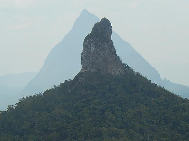 Mount Coonowrin is silhouetyted against Mount Beerwah, Glass House Mountains Sunshine CoastPhoto by Bob Fairless