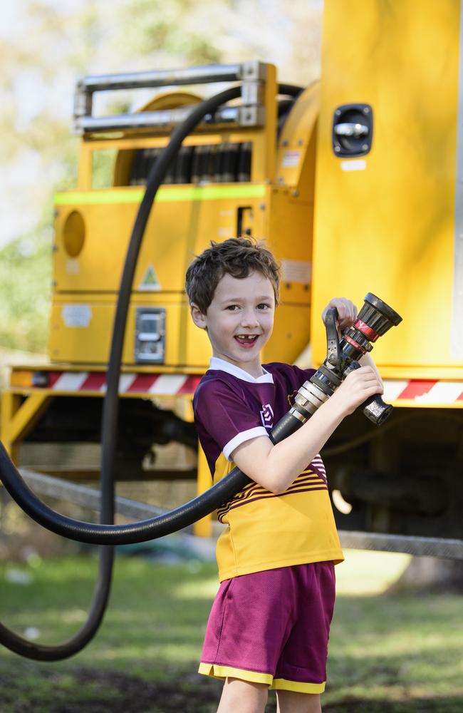 Judah Little with the fire hose from the Cambooya Rural Fire Brigade truck at Sadie's Day Out. The event, a special celebration of the life of five-year-old crash victim Sadie, was held at Cambooya State School, Saturday, June 7, 2025. Picture: Kevin Farmer