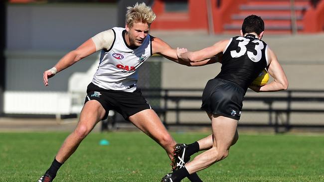 Billy Frampton attempts to tackle Darcy Byrne-Jones at Port Adelaide training at Alberton Oval. Picture: Tom Huntley