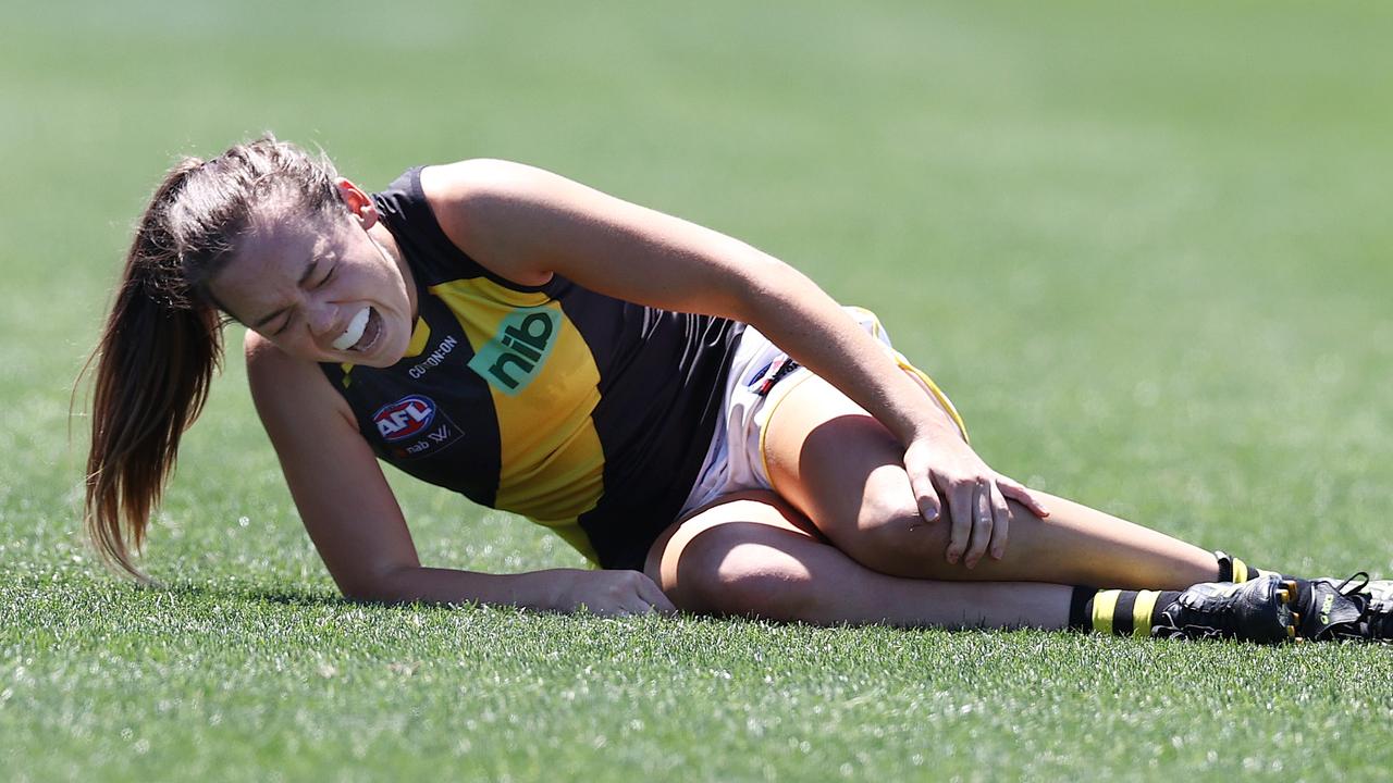 Richmond’s Hannah Burchell grabs her left knee after injuring it in a tackle. Picture: Michael Klein