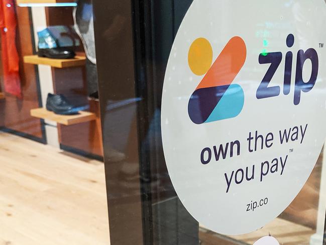 **FILE IMAGE**  Zip signage is seen on a storefront in Sydney, Tuesday, October 22, 2019. By the end of December 2019, 1.8 million customers had an active Zip account that allows them buy now and pay later without a credit card at 20,875 merchants, including Amazon Australia. (AAP Image/Derek Rose) NO ARCHIVING