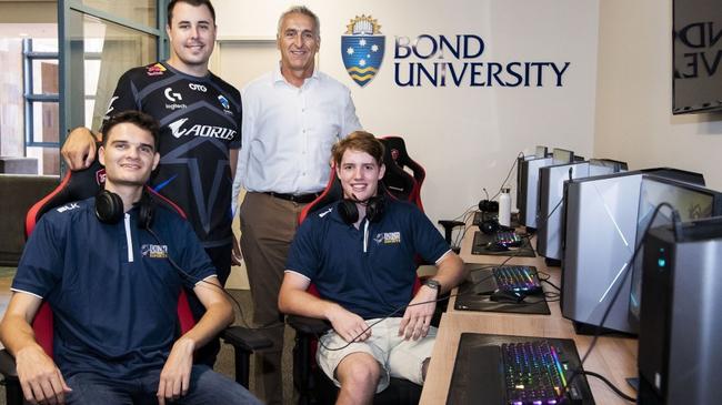 Chiefs CEO Nick Bobir, Bond executive director of Sport Garry Nucifora (back) and Bond students Zak Kouaider and Charles Parsons (front) at the Bond Esports Hub. Picture: Cavan Flynn