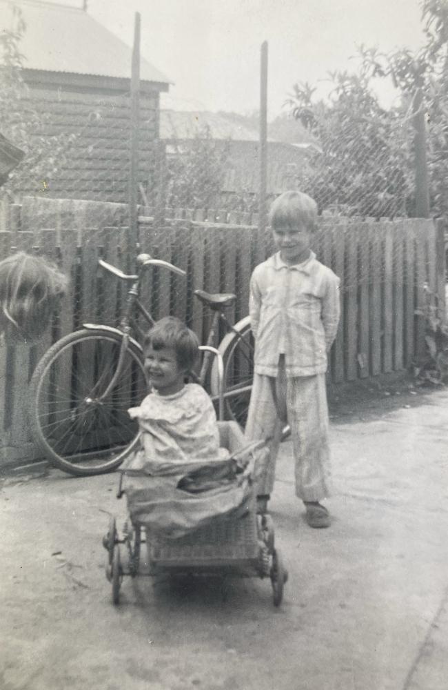Deb, pictured with her brother, was born with no arms and tiny, deformed legs.