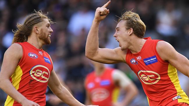 Tom Lynch celebrates one of his career-high eight goals against Carlton with Aaron Young. Picture: AAP Image/Julian Smith