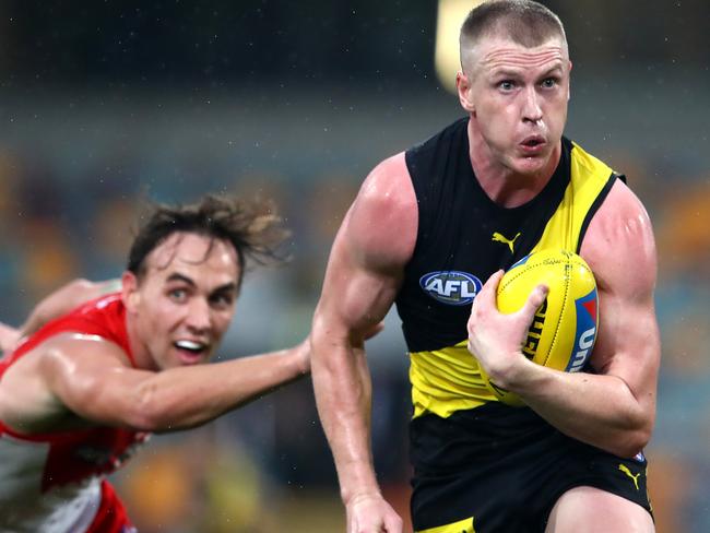 BRISBANE, AUSTRALIA - JULY 12: Josh Caddy of the Tigers makes a run during the round 6 AFL match between The Sydney Swans and the Richmond Tigers at The Gabba on July 12, 2020 in Brisbane, Australia. (Photo by Jono Searle/AFL Photos/via Getty Images)
