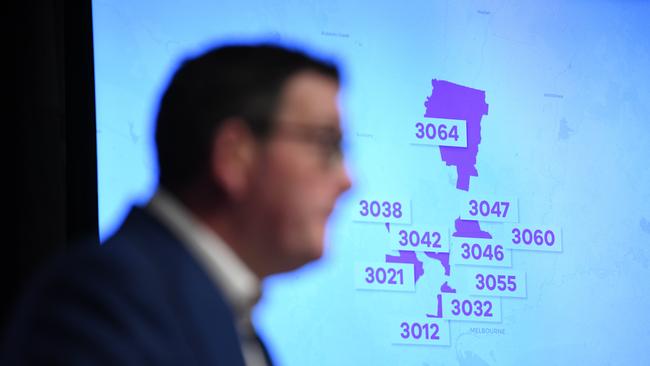 Victorian Premier Daniel Andrews with the postcodes of Melbourne hotspot suburbs. Picture: AAP