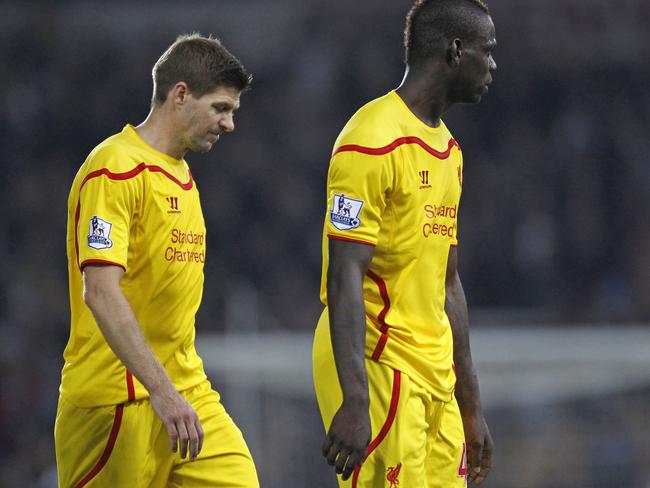 Liverpool's English midfielder Steven Gerrard (L) and Liverpool's Italian striker Mario Balotelli react at the final whistle in the English Premier League football match between West Ham United and Liverpool at The Boleyn Ground, Upton Park, in east London on September 20, 2014. West Ham won the game 3-1. AFP PHOTO/IAN KINGTON RESTRICTED TO EDITORIAL USE. No use with unauthorized audio, video, data, fixture lists, club/league logos or “live” services. Online in-match use limited to 45 images, no video emulation. No use in betting, games or single club/league/player publications.