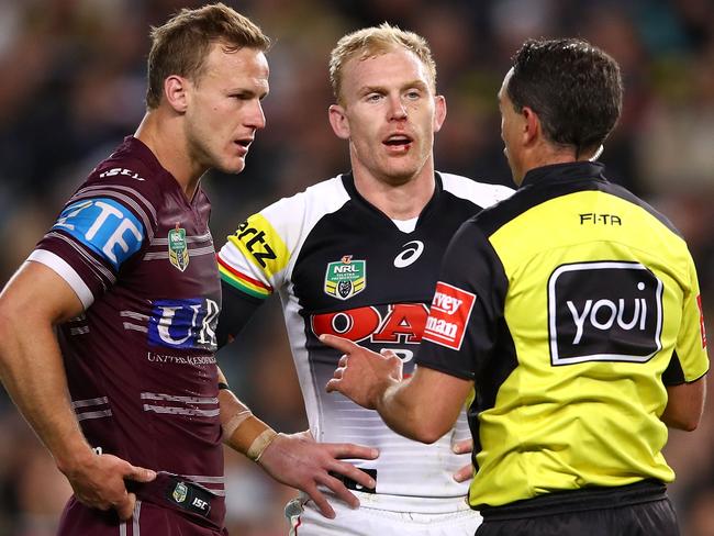 Daly Cherry-Evans and Peter Wallace seek an explanation.