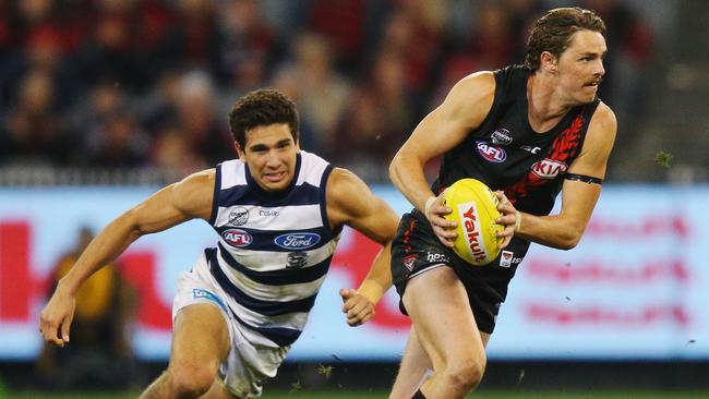 Essendon forward Joe Daniher dashes away from Nakia Cockatoo last week. Picture: Getty Images