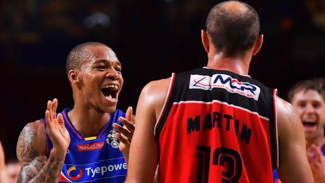 Jerome Randle of the Adelaide 36ers reacts to Rhys Martin of the Illawarra Hawks.