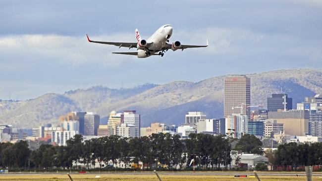 A Virgin 737-7FE aircraft leaves Adelaide airport.