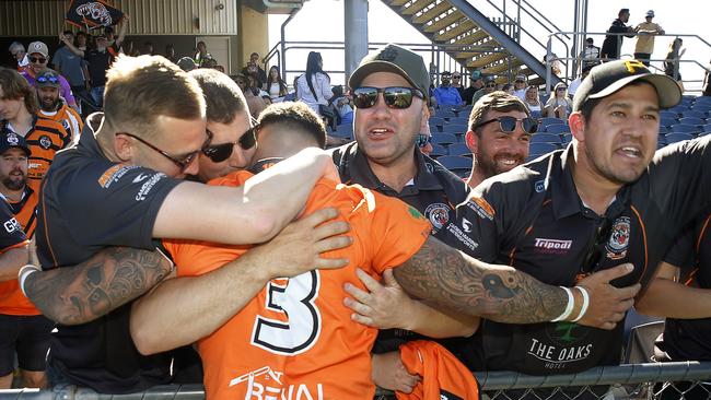 Mobbed: first grade skipper Mitch Brasington (left) and others congratulate Brendon Hearne. Picture: John Appleyard