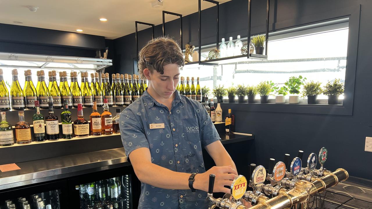 Bartender Matthew Walkerden serving customers at the Melbourne Cup function event at the Ivory Tavern, Tweed Heads. Picture: David Bonaddio