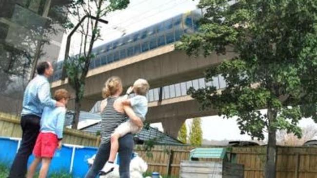 Artists' impression of SKYrail over backyards