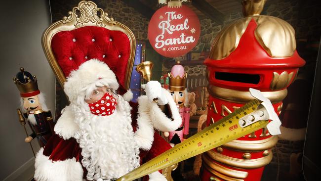 Santa measuring out the 1.5m social distance rule as he prepares for a different Christmas. Picture: David Caird