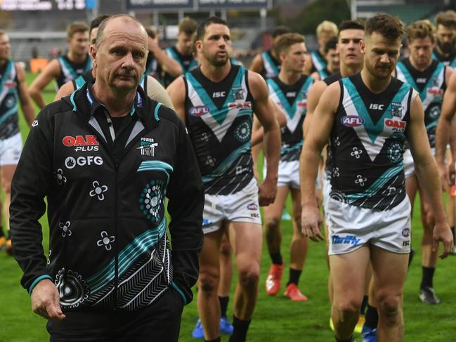 Port Adelaide’s coach Ken Hinkley walks off the UTAS Stadium in Launceston after his side’s 31-point loss at the hands of Hawthorn. Picture: AAP Image/Julian Smith