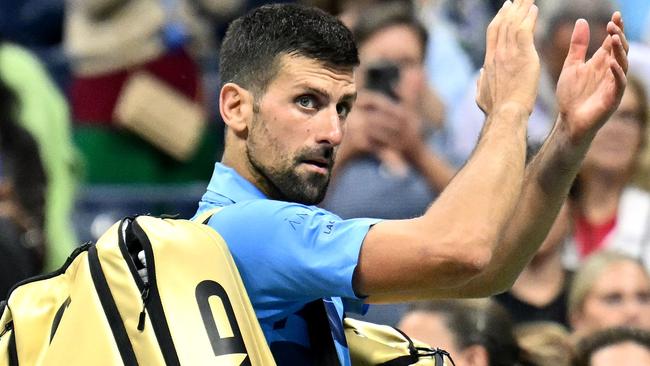 Serbia's Novak Djokovic waves at the crowd after his defeat against Australia's Alexei Popyrin during their men's singles third round match on day five of the US Open tennis tournament at the USTA Billie Jean King National Tennis Center in New York City, on August 30, 2024. (Photo by ANGELA WEISS / AFP)