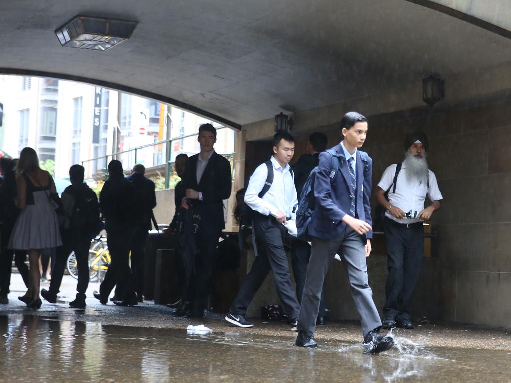 As The low hits Sydney people around town hall .picture John Grainger