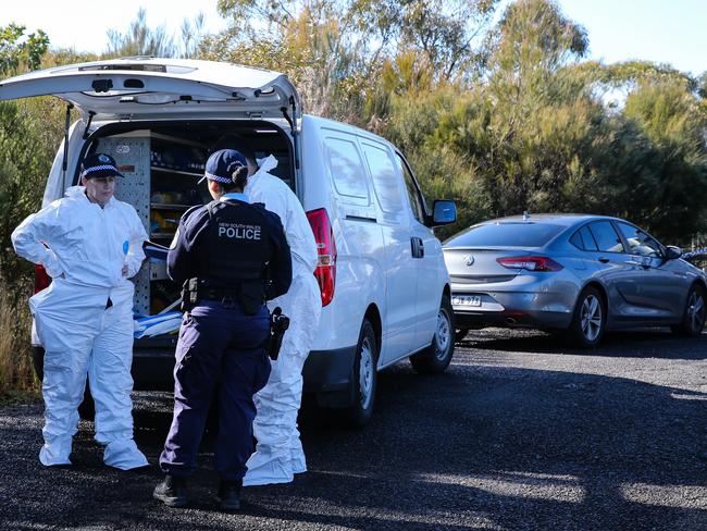 Forensics officers and NSW police at the scene. Picture: Gaye Gerard