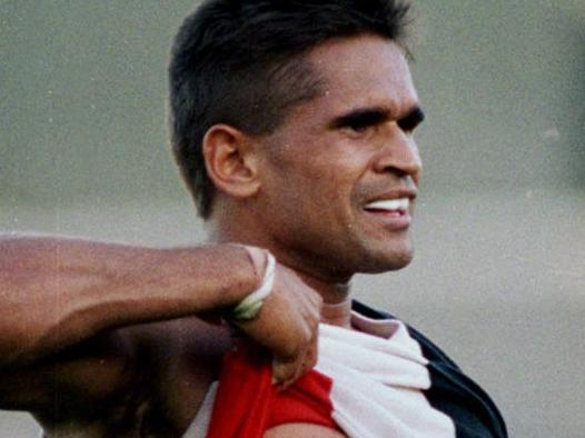 Nicky Winmar lifts his jumper and points to the colour of his skin to the Collingwood supporters at Victoria Park. He had been racially abused by the Collingwood crowd for being an aboriginal. The Saints won the match. St Kilda v Collingwood. 18/04/1993. Pic John FederSTRICT CONDITIONS: There are 50 pictures in this assignment which are for use in The Australian's 50th anniversary magazine. They can not be used elsewhere until after the 15th July 2014. No use is permitted without contacting the Picture Editor of The Australian.