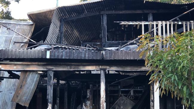 The back of a property in Aranda Dr, Frenchs Forest that was destroyed by fire. Picture: Julie Cross