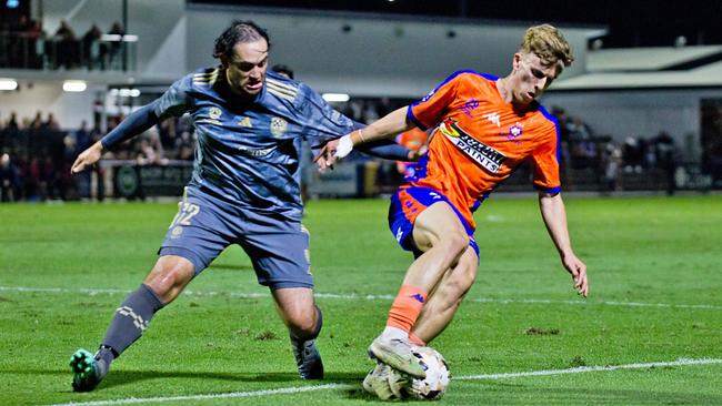 Shelford Dais (left) battles with Jack Skinner of Lions FC. Picture: Lions FC