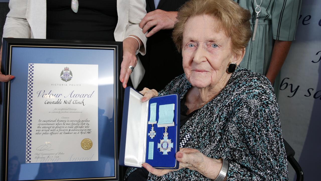 Constable Neil Clinch’s mother Elvie with a Victoria Police Valour medal. Picture: George Salpigtidis