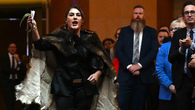 Earlier in the day, Ms Thorpe led a small group of protesters at the barrier of the memorial and was spotted tussling with the police security: Picture: Lukas Coch - AFP.