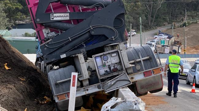 A semi-trailer left Mona Vale Rd at Ingleside and crashed over a concrete safety barrier at a roadworks construction zone on Thursday last week. Picture: Ingleside RFS