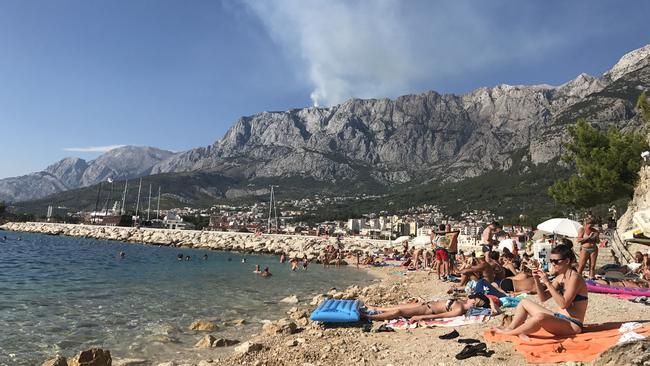 Tourists sunbake on a private beach in Makarska, Croatia. Picture: Rhian Deutrom / The Australian