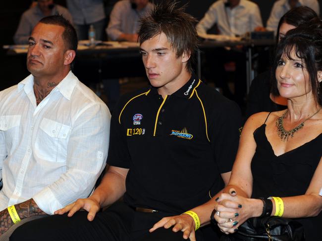 Dustin Martin, centre, with his dad Shen and mum Kathy Knight at the AFL draft in 2009.