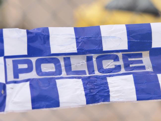 Blue and white Police tape cordoning off a area with a yellow car at a industrial area, Australia 2016Police tape cordoning off a area with a yellow car - Stock image  ipad generic