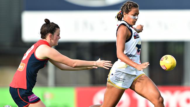 Adelaide’s Tayla Thorn gets her kick away in front of Melbourne’s Jasmine Grierson.